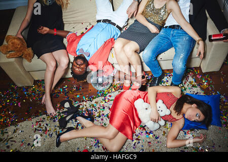 Drunk and tired people sleeping after party Stock Photo