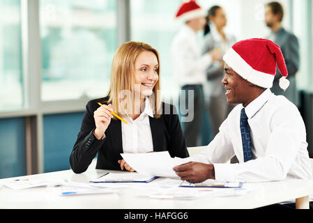 Two specialists working in office on Christmas day Stock Photo