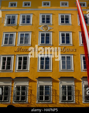 Yellow Facade of Mozarts Geburtshaus, Mozart's birthplace, on Getreidegasse Street in historic centre of Salzburg, Austria Stock Photo