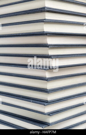 Stack of dusty hardcover books Stock Photo