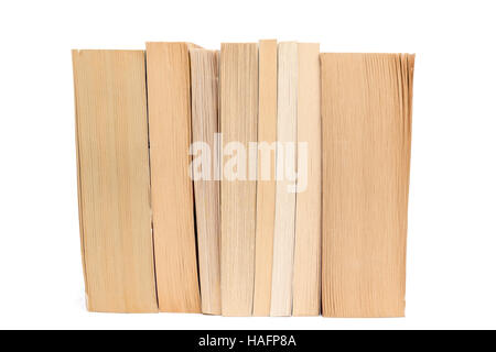 Row of old paperback books isolated on a white background Stock Photo