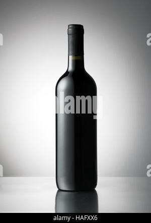 Plain capped red wine bottle with a blank label space for branding or advertising Stock Photo