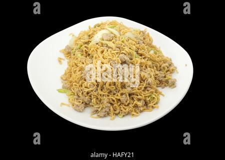 Thai cuisine , Asian stir fried noodle  with minced pork and vegetable on black background Stock Photo