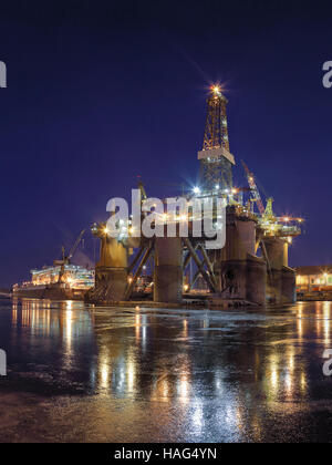 Oil rig under construction at night in Gdansk, Poland. Stock Photo