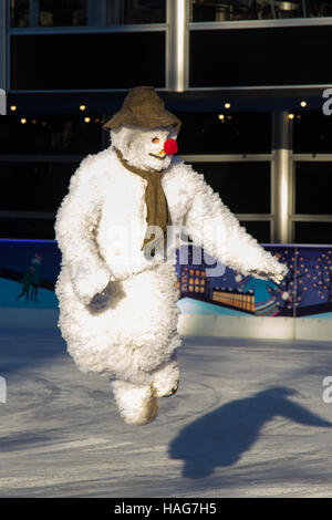 Natural History Museum, London, UK. 30th Nov, 2016. On the coldest week of the year The Snowman from from The Peacock Theatre's production takes to the ice at the Natural History Museum Ice Rink in London. Credit:  Paul Davey/Alamy Live News Stock Photo