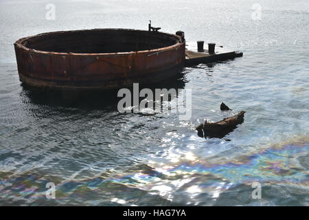 FILE - A file picture dated 23 April 2015 shows a film of oil on the surface of the sea near Pearl Harbour, Hawaii, USA. Even after 75 years, oil is still leaking from the wreck of hte USS Arizona at the Pearl Harbor naval base in Hawaii. Japan attacked the harbour on 07 December 1941, destroying part of the US Pacific Fleet. Photo: Chris Melzer/dpa Stock Photo