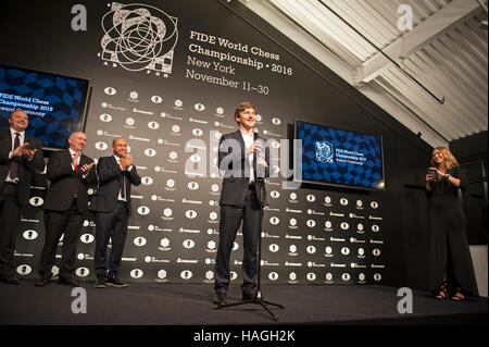 New York, USA. 30th Nov, 2016. Sergey Karjakin of Russia acknowledging applause on Nov. 30, 2016 after losing a 13-day match against Magnus Carlsen of Norway for the title of FIDE World Chess Champion — a title that Carlsen already held and had to defend. Karjakin played so well that the 12 regulation games in the match ended in a draw and the outcome had to be decided in an extra day of rapid games. The match was held in the South Street Seaport in Manhattan, New York City.  Credit:  Terese Loeb Kreuzer/Alamy Live News Stock Photo