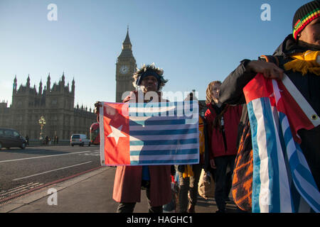 London, UK. 1st Dec, 2016. A small group of protesters gather on Westminster Bridge joined by activist Peter Thatchell against the Indonesian occupation of West Papua which was annexed by Indonesia in 1961 Credit:  amer ghazzal/Alamy Live News Stock Photo