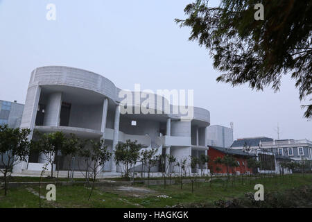 Suzhou, Suzhou, China. 1st Dec, 2016. Suzhou, CHINA-December 1 2016: (EDITORIAL USE ONLY. CHINA OUT).More than ten 3D printed buildings are seen at a factory in Suzhou, east China's Jiangsu Province, December 1st, 2016. The 3D printed buildings include ancient Chinese architectures, modern Chinese architectures, six-storey buildings, mobile buildings and luxurious villa covering 1,100 sqm. Compared to traditional buildings, 3D printed buildings can save much time, labor and cost, which will be more environmental-friendly. Besides, people will feel warmer inside the 3D printed building becau Stock Photo