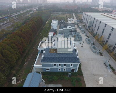 Suzhou, Suzhou, China. 1st Dec, 2016. Suzhou, CHINA-December 1 2016: (EDITORIAL USE ONLY. CHINA OUT).More than ten 3D printed buildings are seen at a factory in Suzhou, east China's Jiangsu Province, December 1st, 2016. The 3D printed buildings include ancient Chinese architectures, modern Chinese architectures, six-storey buildings, mobile buildings and luxurious villa covering 1,100 sqm. Compared to traditional buildings, 3D printed buildings can save much time, labor and cost, which will be more environmental-friendly. Besides, people will feel warmer inside the 3D printed building becau Stock Photo