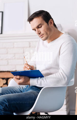 Professional psychologist making notes Stock Photo