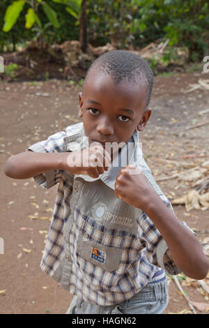 Young African Boy in rural children in Tanzania,Africa at play and work having fun Stock Photo