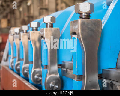 Detail photo of twin screw industrial press for processing, of food byproducts. Shallow depth of field. Stock Photo