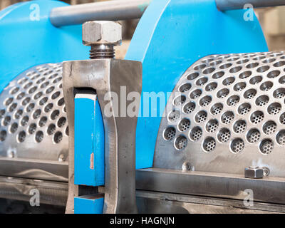 Detail photo of twin screw industrial press for processing, of food byproducts. Stock Photo