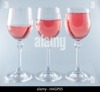 Isolated Pink wine in stemmed glasses on white background Stock Photo