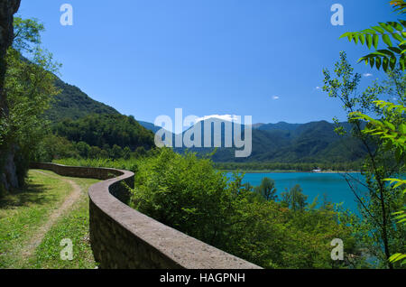 Quiet road with panorama on the lake of Cavazzo in Friuli Venezia Giulia, Italy Stock Photo