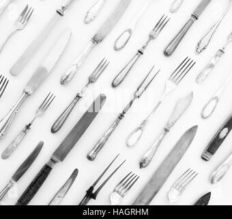 beautiful silver cutlery - vintage flatware isolated on white background -  decorative knife and fork pattern Stock Photo