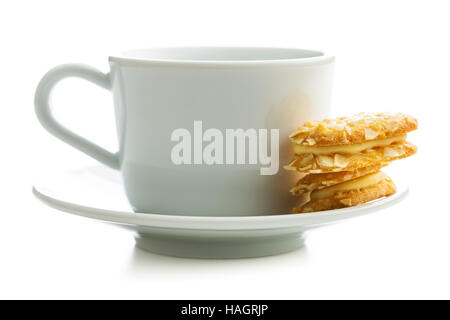 Sweet almond cookies and cup of tea isolated on white background. Stock Photo