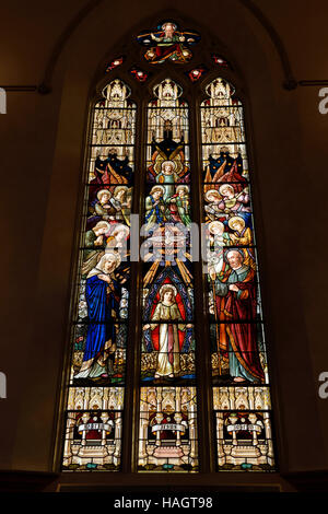 Renovated stained glass window of the Holy Family at St Michael's Cathedral Basilica Toronto Stock Photo