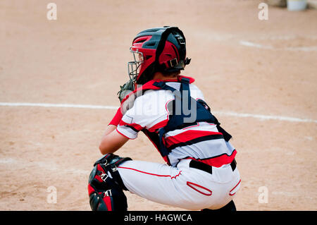 American little league baseball catcher  behind home plate. Stock Photo