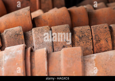 A stack of used clay pots in the garden Stock Photo