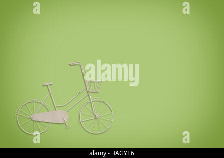 Vintage model  bicycle on light green background. Stock Photo