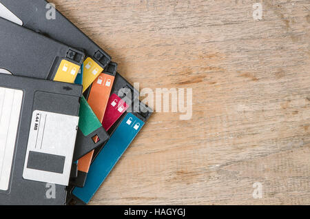 Used floppy diskettes on wooden background. Stock Photo