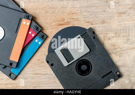 Used floppy diskettes on wooden background. Stock Photo