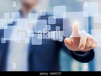 Abstract business concept, businessman touching a button on a virtual interface, technology Stock Photo