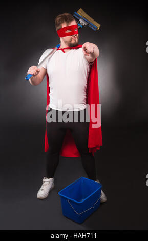 Super hero with cleaning equipment Stock Photo