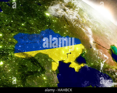 Ukraine with embedded flag on planet surface during sunrise. 3D illustration with highly detailed realistic planet surface and visible city lights. El Stock Photo