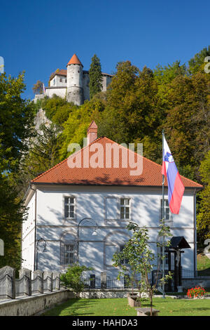 St. Martin's Parish Church with Bled Castle looming beyond, Bled, Upper Carniola, Slovenia Stock Photo