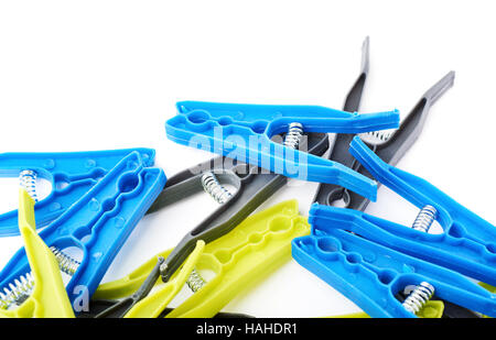 Pile of cloth pegs isolated over white background Stock Photo