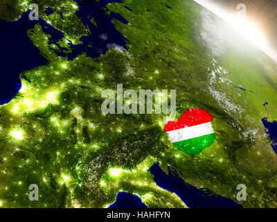 Hungary with embedded flag on planet surface during sunrise. 3D illustration with highly detailed realistic planet surface and visible city lights. El Stock Photo