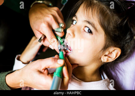 Little girl getting dental treatment in dentist office Stock Photo