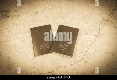 Two passports on a map, european country passports Stock Photo