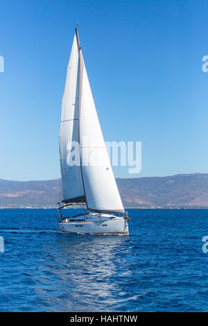 Sailing ship boats with white sails in the Sea. Luxury yachts. Stock Photo