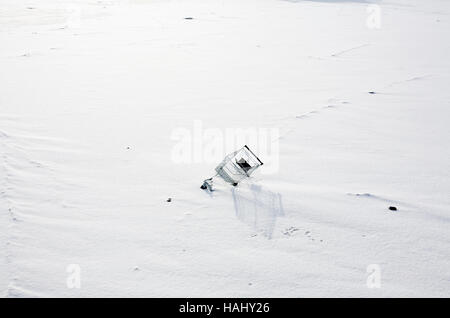 shopping trolley in snow Stock Photo