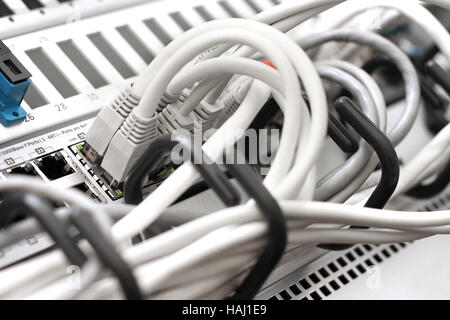 network cables and servers in a technology data center Stock Photo