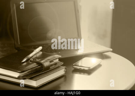 office desk with a computer and a telephone diary Stock Photo