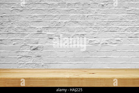 empty shelf on white brick wall Stock Photo