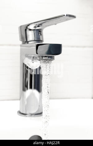 water tap with flowing water Stock Photo