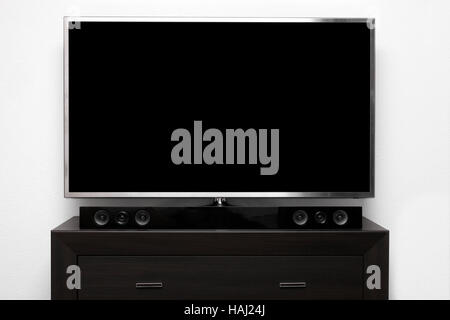 blank tv with stereo system on brown commode Stock Photo