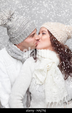 Young happy couple dressed in warm clothes in winter Stock Photo