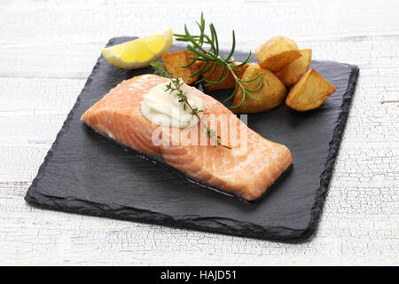 salmon steak with fried potatoes Stock Photo