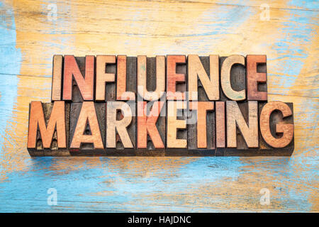 influence marketing - word abstract in vintage letterpress wood type printing blocks Stock Photo