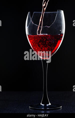 Still-life with the wine broken glass on black Stock Photo