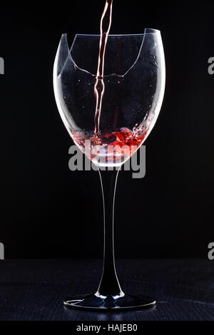 Still-life with the wine broken glass on black Stock Photo