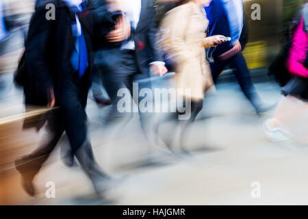 crowd of walking people in the city in motion blur Stock Photo
