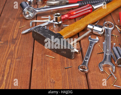 Set of different work tools on wooden surface Stock Photo